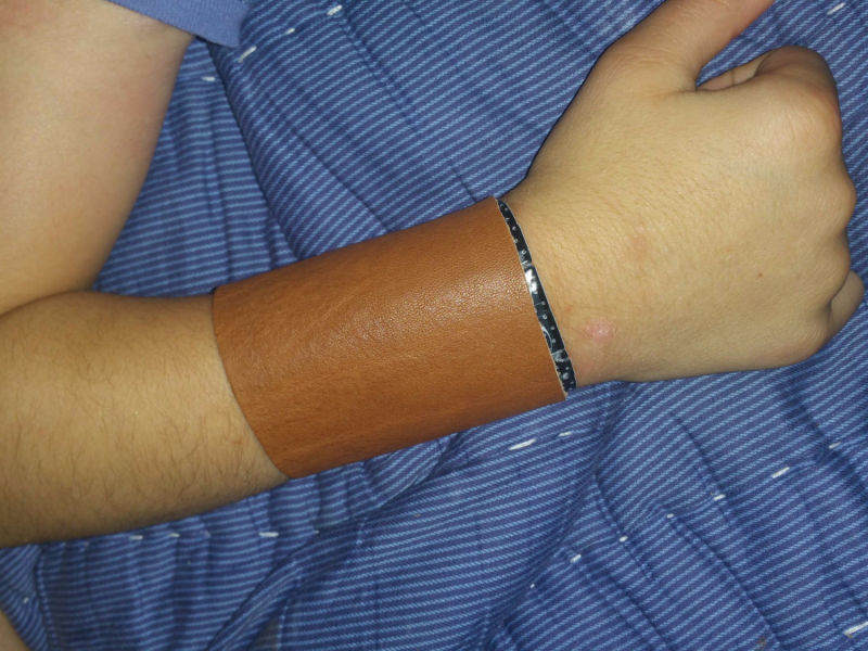 image of an arm with a leather bite guard