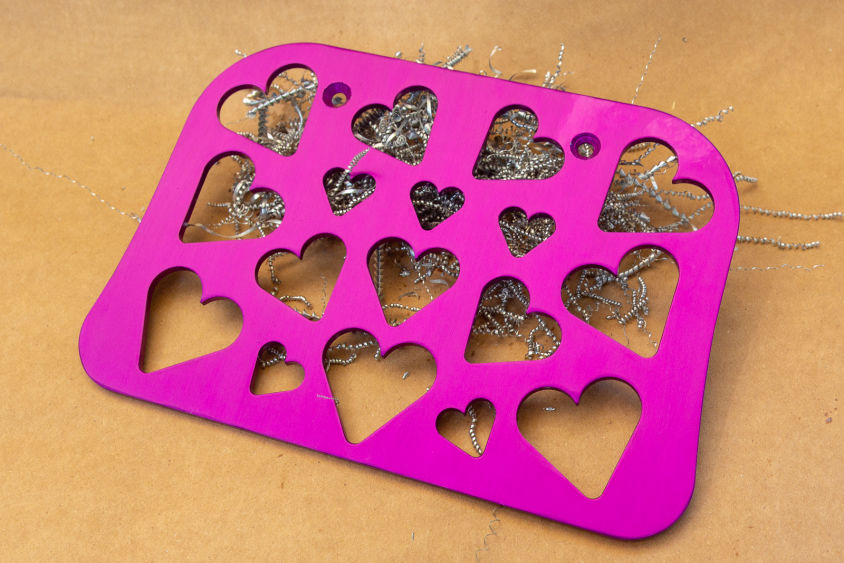 image of custom wheelchair footplate with hearts cut into it